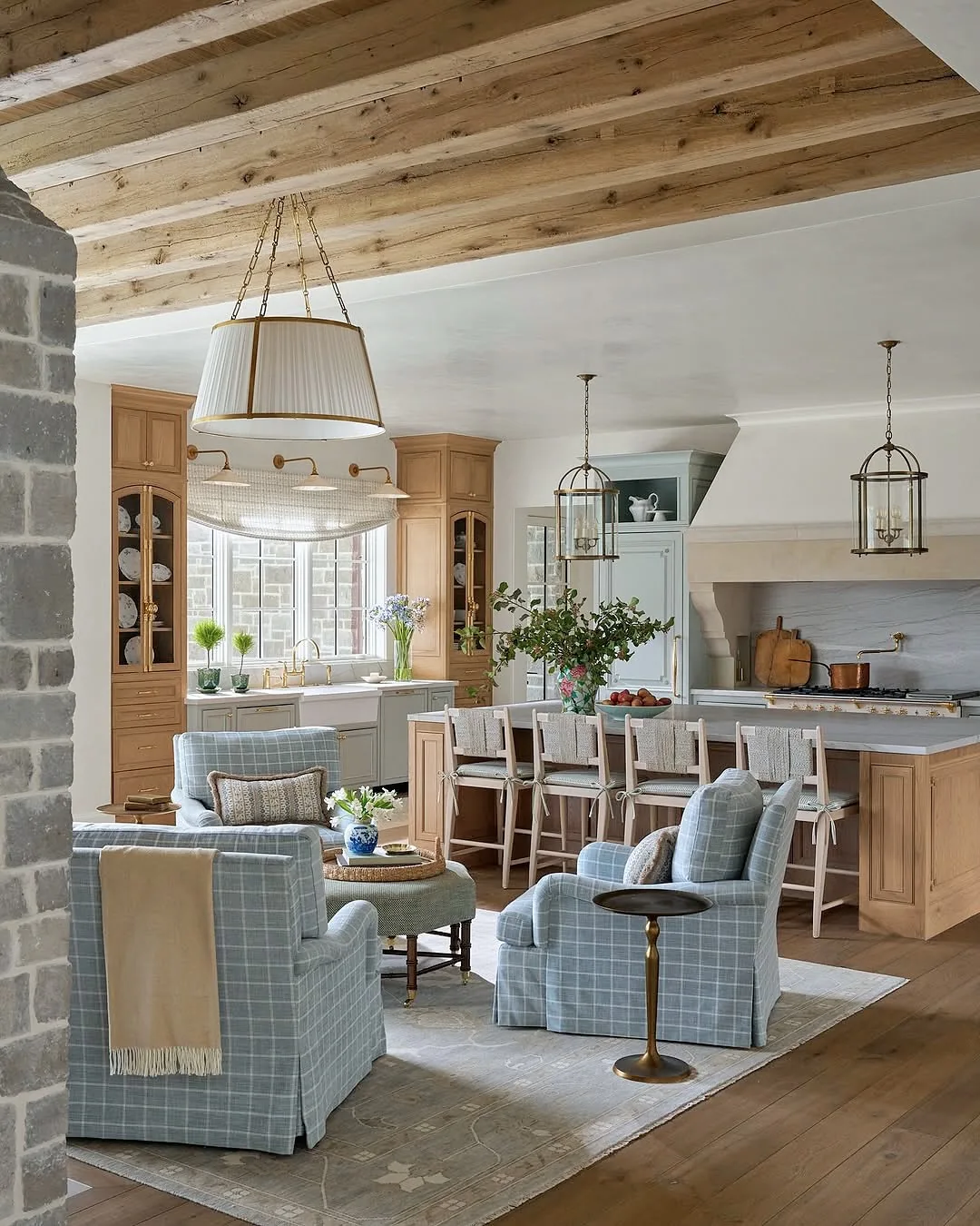 Open plan kitchen and living room with plaid chairs