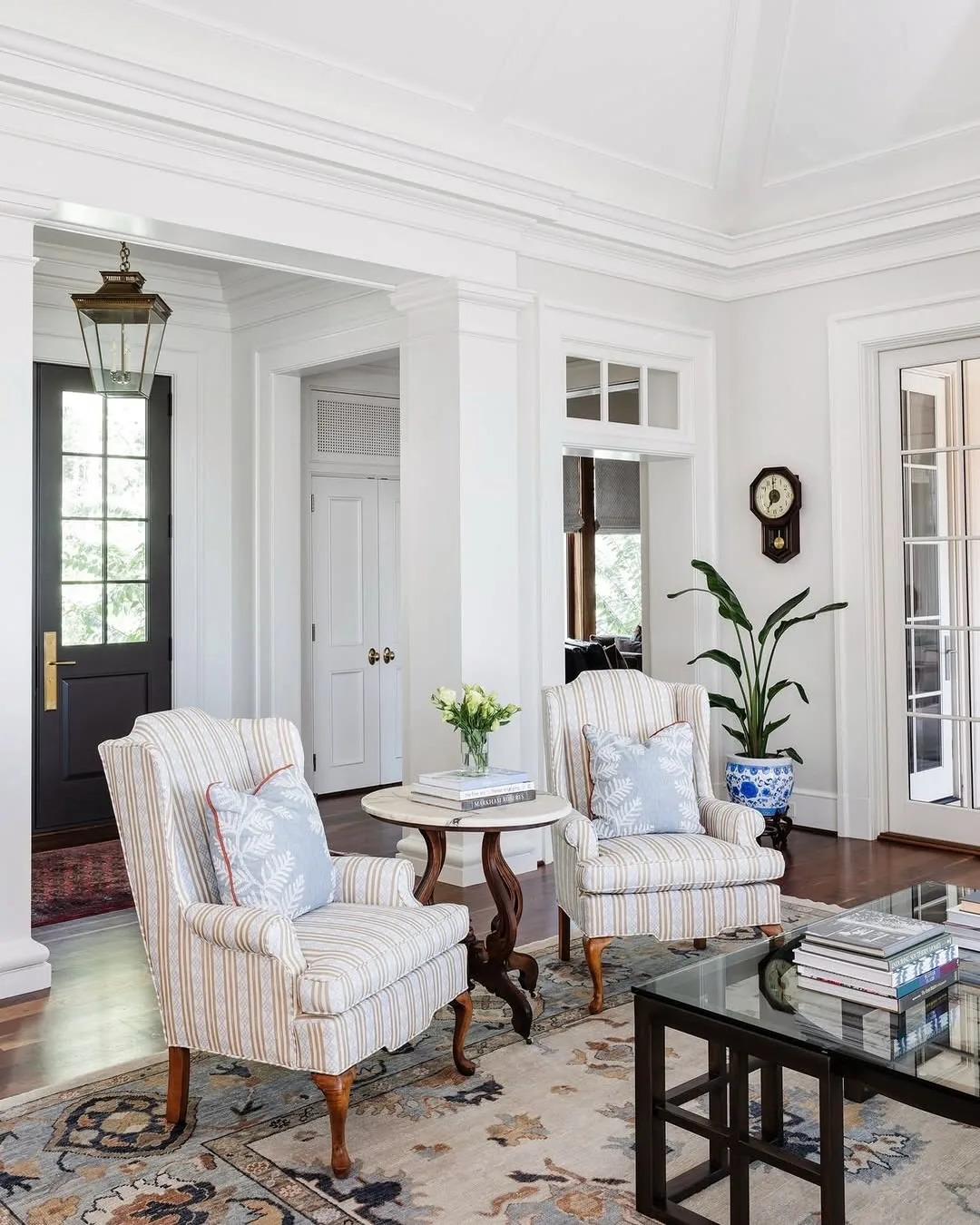 Striped armchairs in a white living room