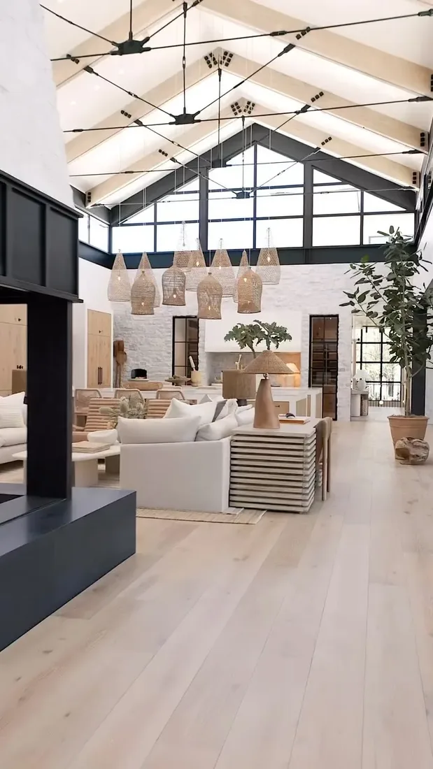 Modern living room with low sofa, timber accents and soft textiles