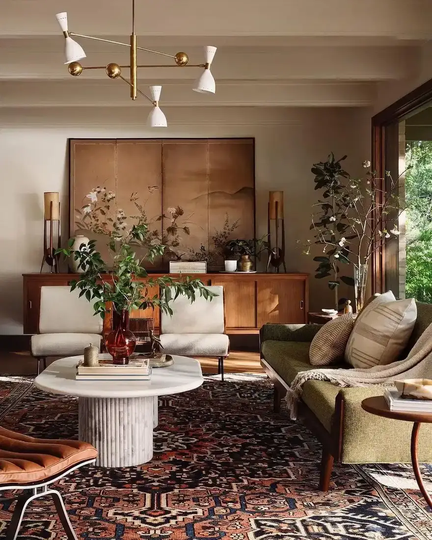 Modern living room with warm neutral palette, soft textiles and timber accents