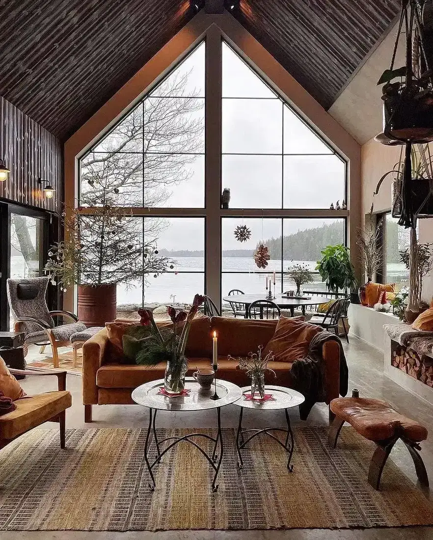 Rustic cabin living room with barn conversion gable window, timber beams and soft textiles