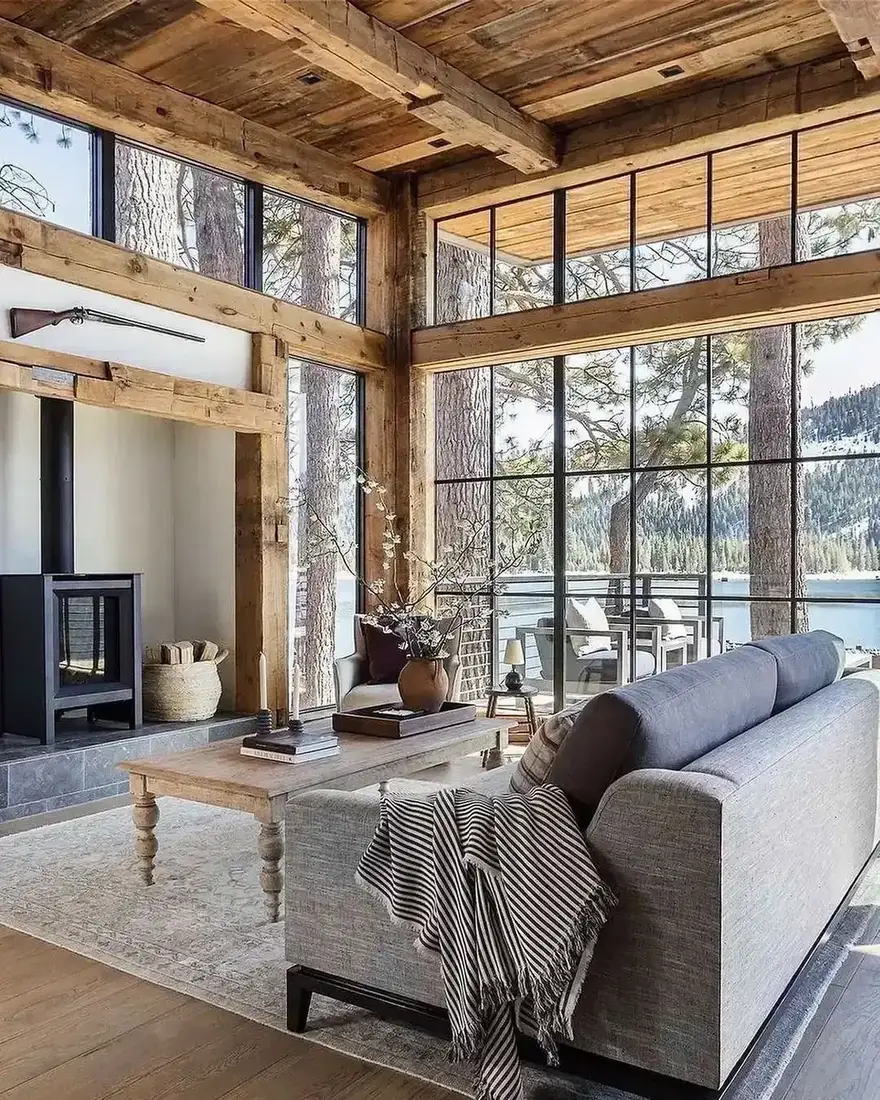 Rustic living room with timber beams, stone fireplace and soft furnishings