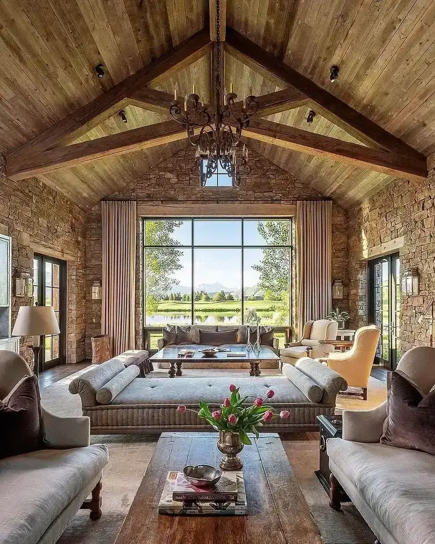 Living room with timber beams, white walls and layered textiles