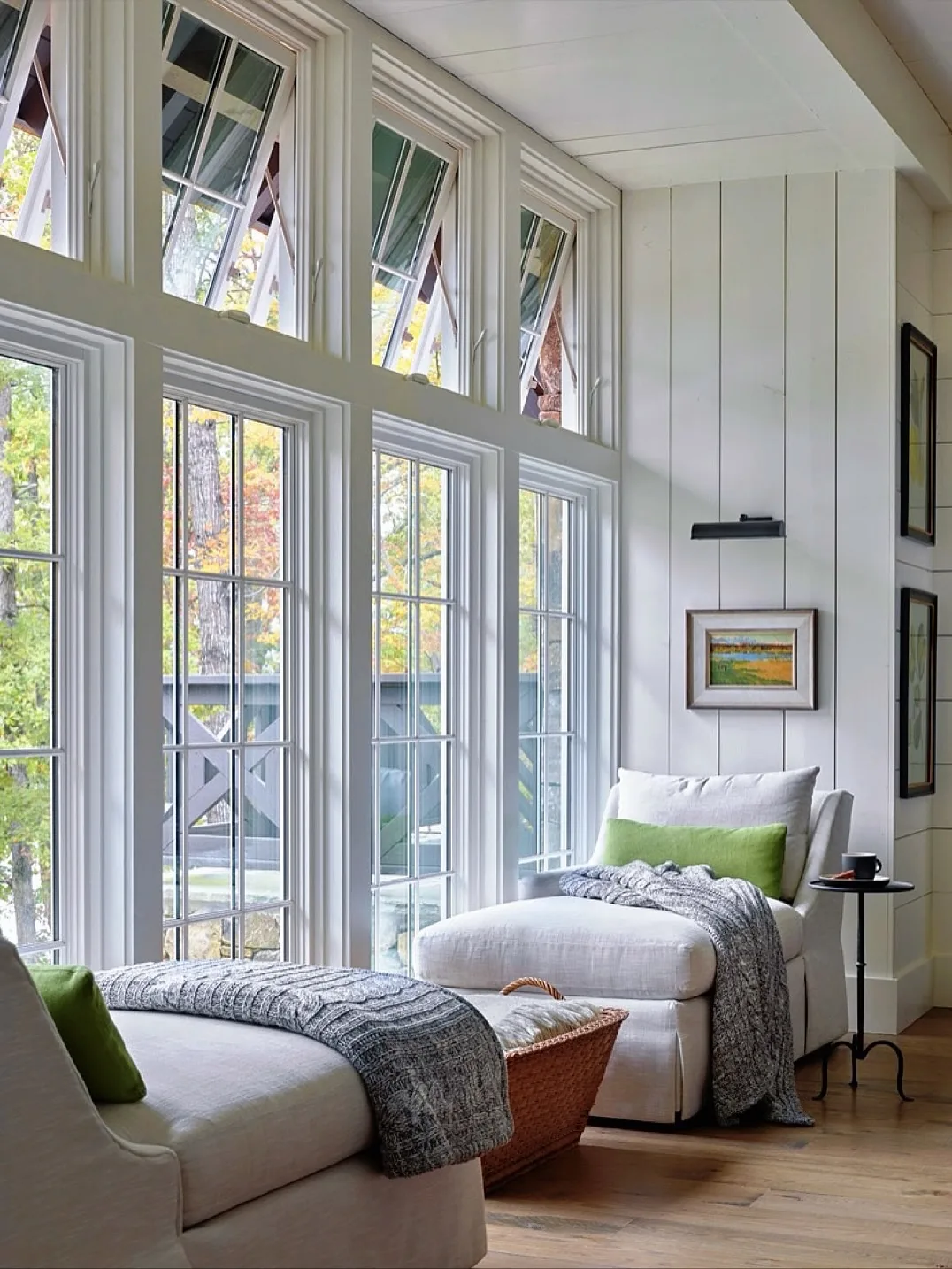 Bright sunroom reading nook with colorful decor