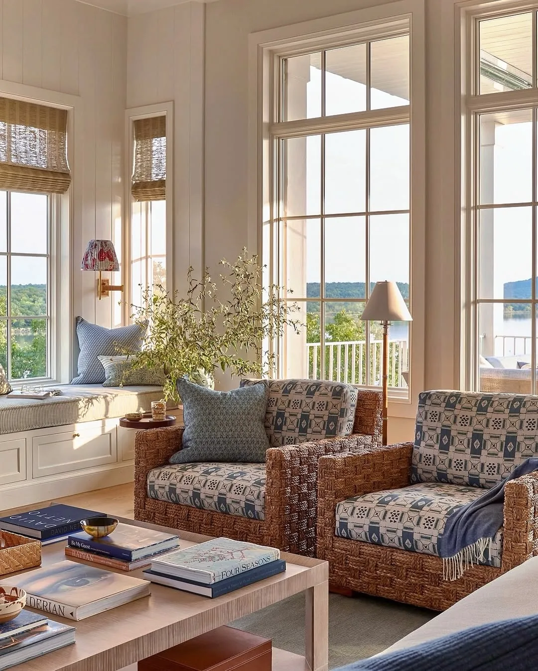 Coastal living room window seat with blue prints