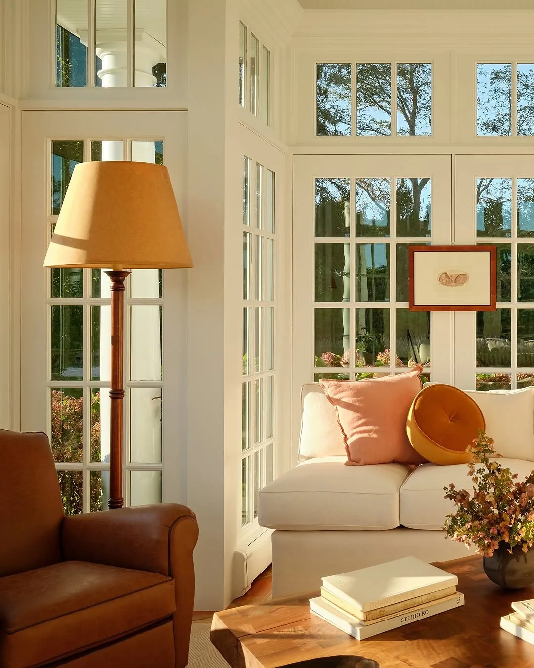 Cozy sunroom window seat with garden views
