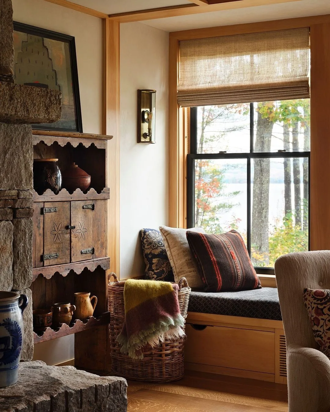 Lake house window seat with an antique cupboard